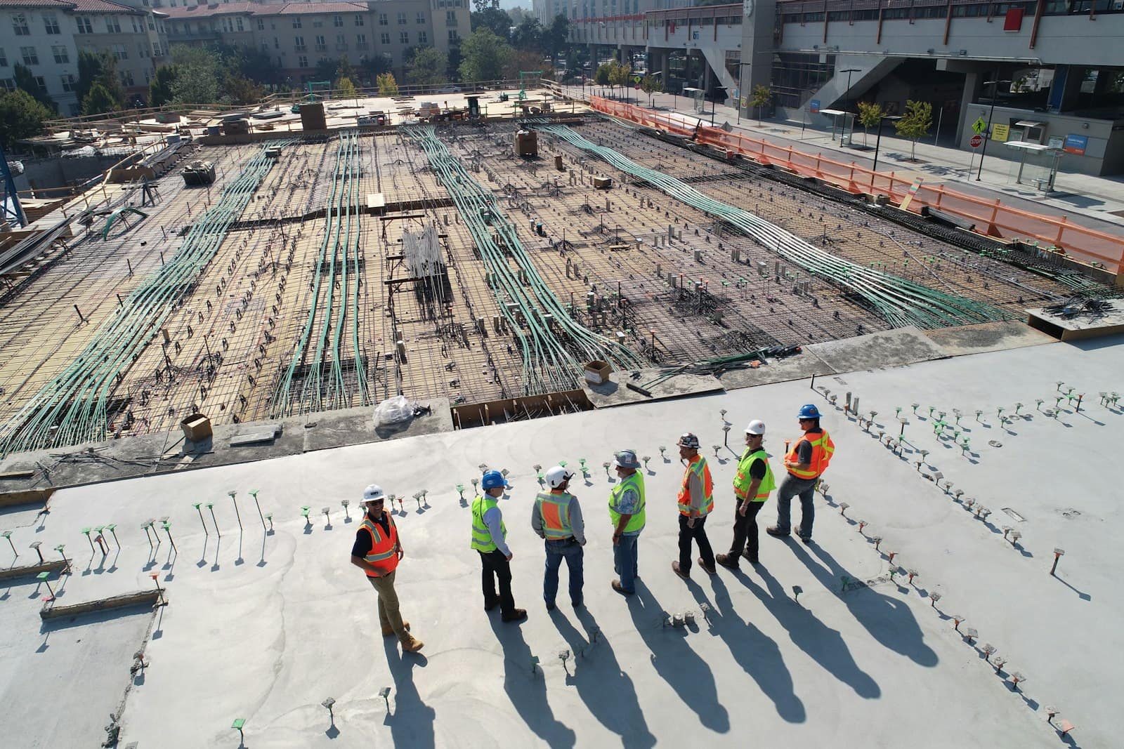 Aerial view of a project site with workers